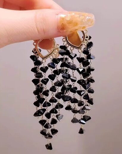 Long sequinned tassel earrings
